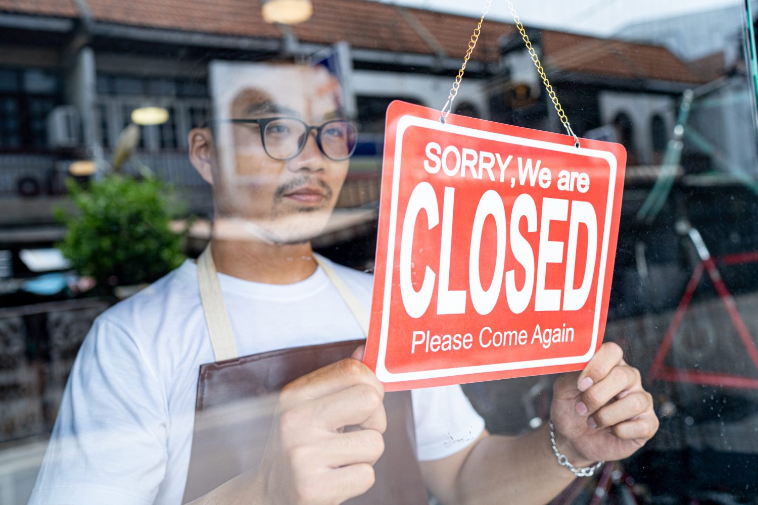 A business owner is forced to hang up a “closed” sign after a natural disaster.